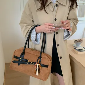 Brown frosted Boston bag with black handles and creative beaded pendant detail