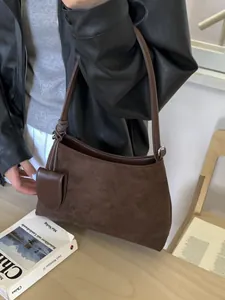Retro dark brown faux suede underarm bag with mini pouch shown on model