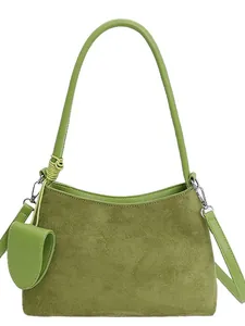 Retro grass green suede handbag with crossbody strap and matching mini pouch