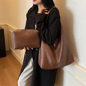 Brown litchi grain leather tote bag set with matching zippered clutch pouch for women