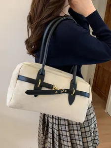 Retro Boston shoulder bag in cream suede with black leather straps and gold metal hardware