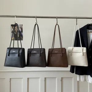 Minimalist leather tote bag set in four colors with stylish metal bead strap accents