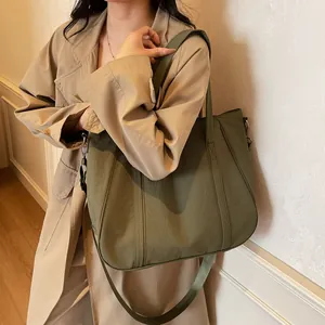 Detail of olive green large capacity tote bag with adjustable shoulder strap