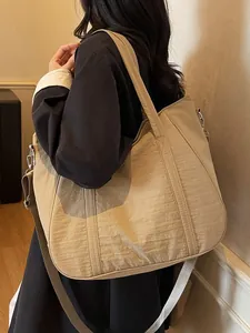 Large khaki nylon tote bag with wide shoulder strap and crossbody strap for women