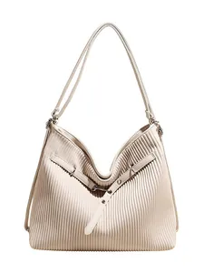 Minimalist beige pleated tote bag with slim shoulder straps and metallic buckle detail