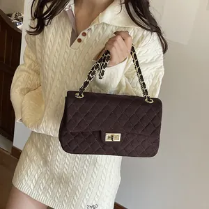 Quilted velvet shoulder bag with gold chain strap in dark brown melange finish