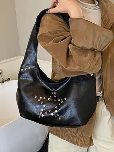Fashionable punk style black underarm bag with silver metallic star rivet pattern