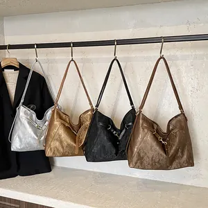 Detailed display of vintage pleated tote bags in silver, gold, black and bronze colors