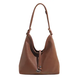 Brown leather Hobo tote bag with knotted shoulder strap and silver moon charm pendant