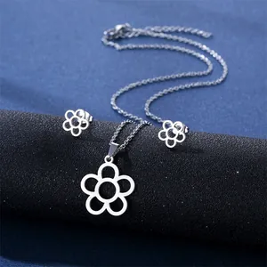 Detail of silver hollow five-petal flower necklace and stud earrings jewelry set