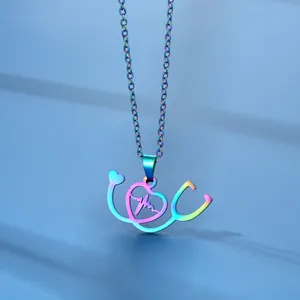 Rainbow plated stethoscope heart necklace with heartbeat line on a deep blue background