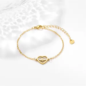 Golden stainless steel chain bracelet with a hollow heart and heartbeat charm on white back