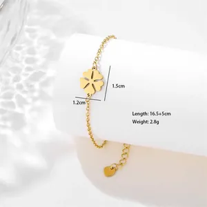 Macro detail of golden stainless steel flower bracelet with clover charm and measurements