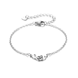 Polished stainless steel stethoscope heart bracelet with adjustable chain on white background
