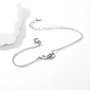 Detail of stainless steel stethoscope bracelet with heart and heartbeat charm