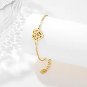 Gold plated stainless steel bracelet with hollow heart pendant and leaf pattern engraving