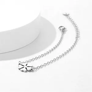 Detailed view of stainless steel clover bracelet with lobster clasp and extension chain