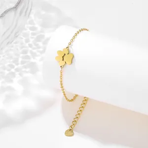 Golden stainless steel bracelet featuring a minimalist clover pendant on a thin O-link chain