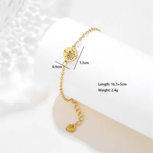 Detail of gold stainless steel tree of life bracelet with heart charm and size data
