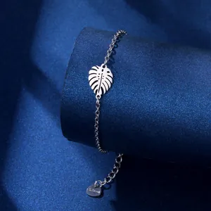 Minimalist silver stainless steel bracelet featuring a hollow palm leaf charm and adjustable chain