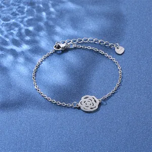 Detailed macro of stainless steel hollow rose bracelet with lobster clasp and extension chain