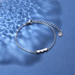 Detail of silver stainless steel heart link bracelet with lobster clasp and extension chain