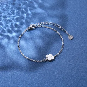 Minimalist silver stainless steel chain bracelet with polished clover pendant and heart tag