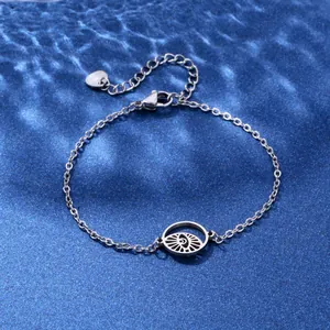Silver stainless steel eye bracelet with hollow pendant on blue water ripple background