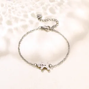 Macro shot of silver snowman charm on stainless steel chain with lobster clasp detail