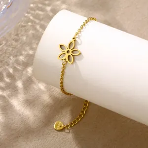 Detailed macro view of the gold-plated stainless steel flower charm and clasp