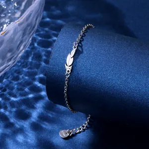 Minimalist silver stainless steel feather charm bracelet with adjustable extension chain