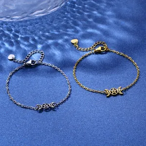 Golden and silver stainless steel crescent moon and pentagram bracelets in blue lighting