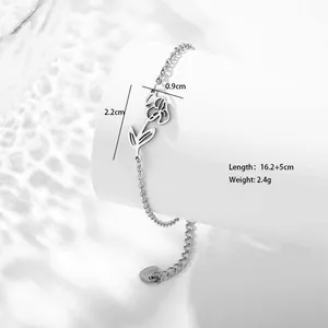 Detail of silver birth flower bracelet with hollow floral pendant and adjustable extension chain