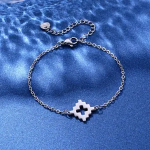 Polished stainless steel chain bracelet with hollow star pendant on blue silk fabric