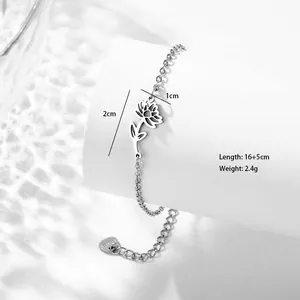 Detailed view of the hollow sunflower pendant with size labels on a silver-tone bracelet