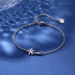 Detail of silver stainless steel palm tree pendant with adjustable lobster clasp chain
