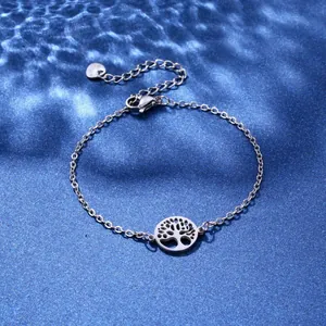 Close-up of silver stainless steel chain bracelet with Tree of Life charm and heart tag
