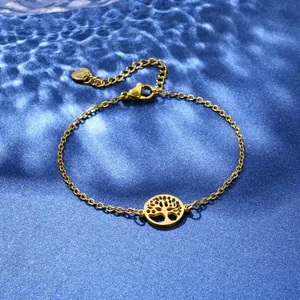 Close-up of gold stainless steel bracelet featuring a Tree of Life pendant with adjustable chain