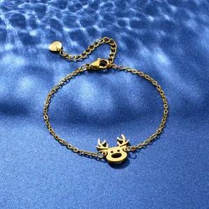 Close-up of golden stainless steel elk pendant bracelet on blue wavy background