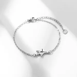 Polished stainless steel starfish bracelet with delicate link chain and heart charm