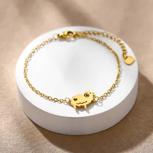 Detailed shot of golden stainless steel chain with a cute sheep charm and lobster clasp