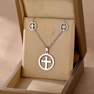 Polished silver stainless steel cross pendant necklace and stud earrings set in a gift box