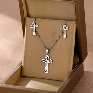 Minimalist stainless steel cross necklace and stud earrings set in a premium jewelry box