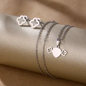 Polished stainless steel heart and clover jewelry set including earrings and necklace