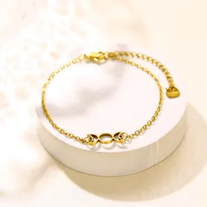 Gold triple moon Celtic knot bracelet in stainless steel with a heart charm extender