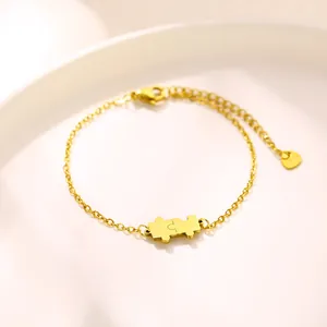Adjustable golden stainless steel puzzle piece bracelet with heart charm and lobster clasp