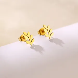 Detailed view of golden stainless steel leaf earrings with polished metal surface and stud back