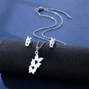 Silver stainless steel jewelry set featuring serrated star pendant necklace and earrings
