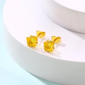 Boucles d'oreilles carrées en zircon jaune avec monture à quatre griffes dorées sur socle