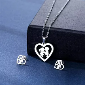 Macro detail of stainless steel heart necklace and earrings with romantic silhouette